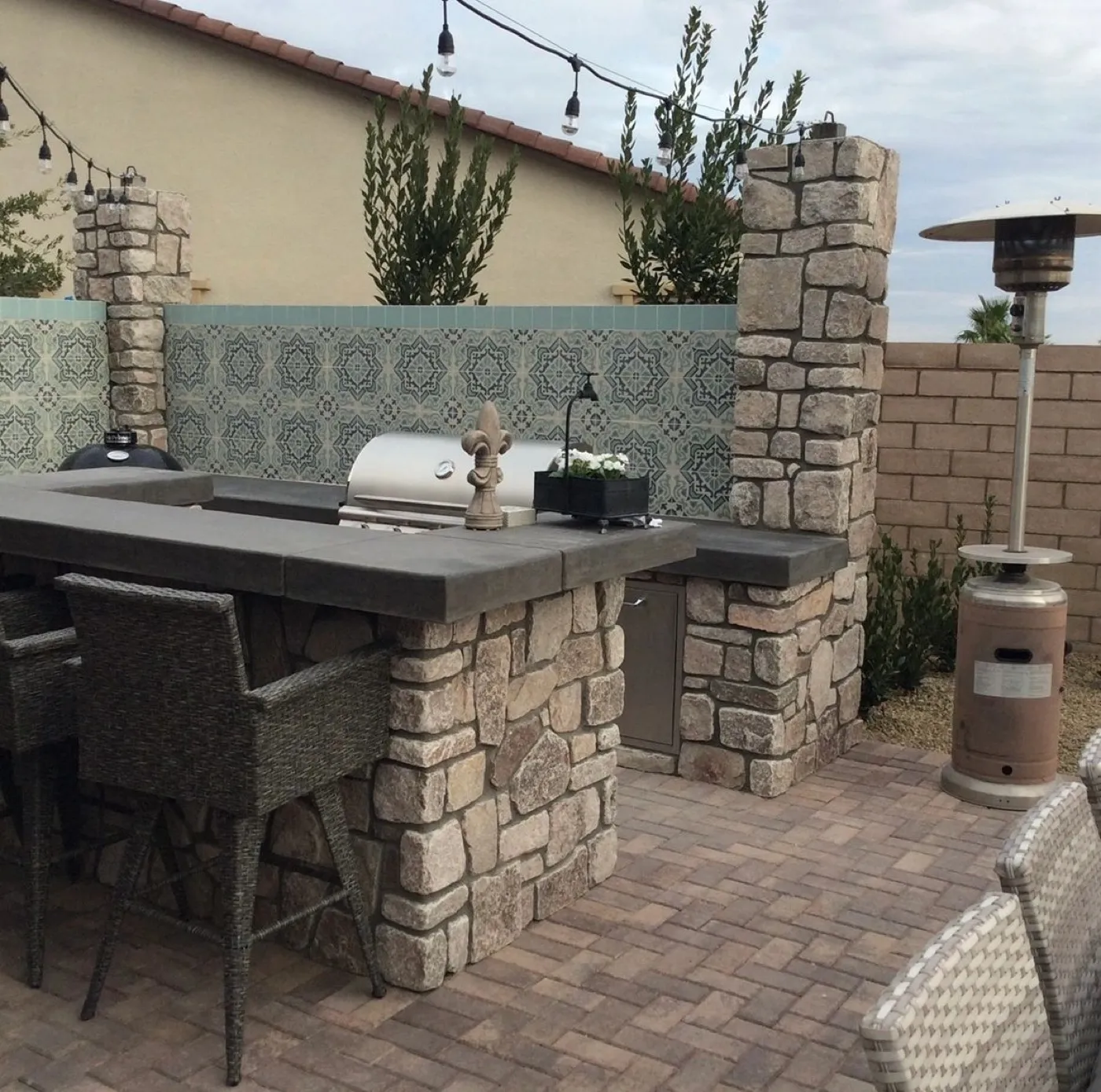 Custom BBQ island with grill and counter seating