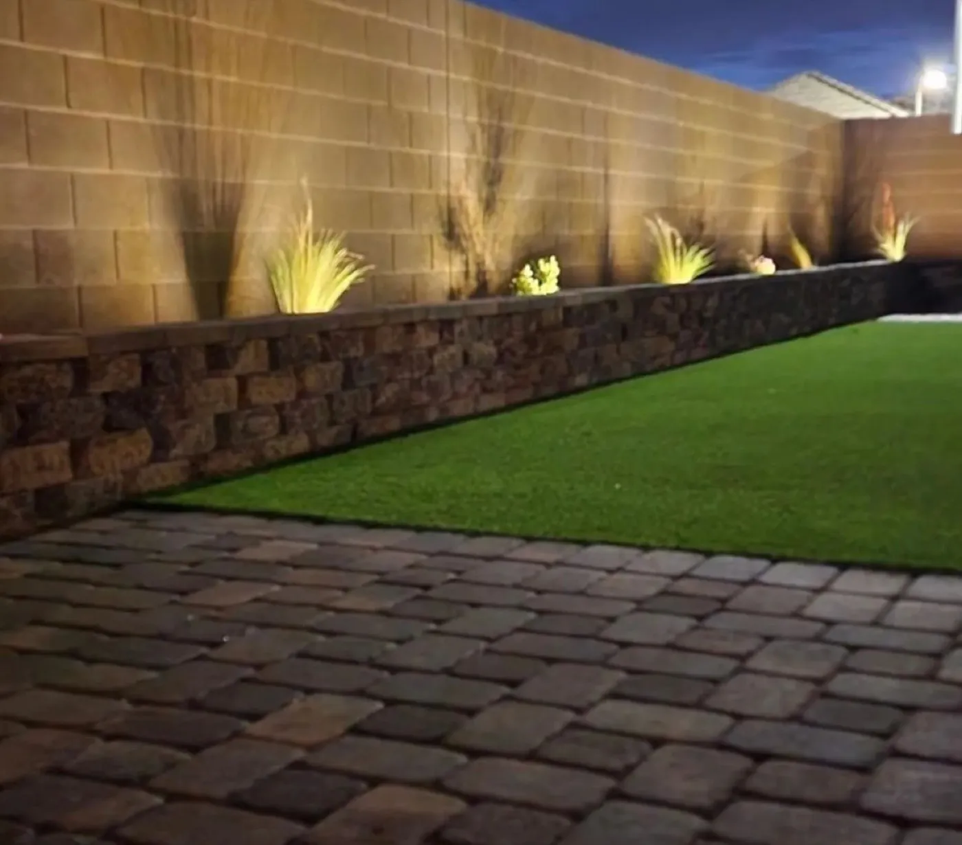 Block planter wall lit at night