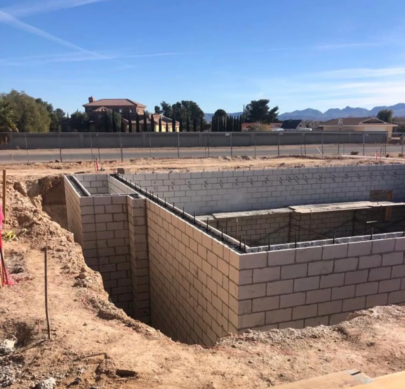 Cinder block foundation walls set on poured footings