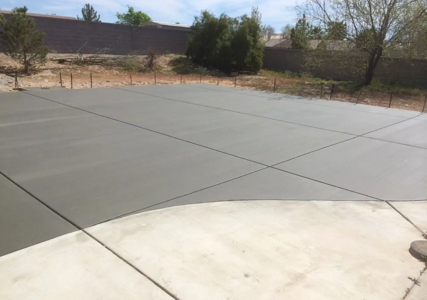 Broom finished concrete flatwork after a large pour